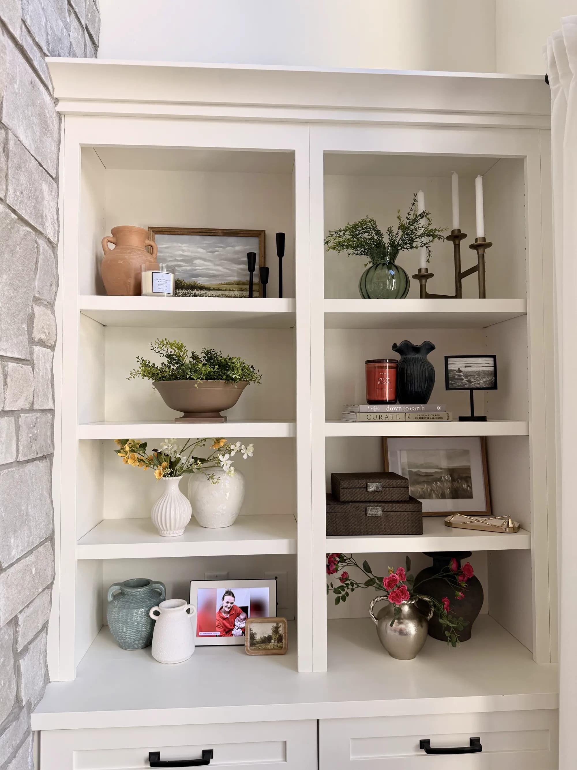 White built-in display shelving with styled decor by BK Toolbox