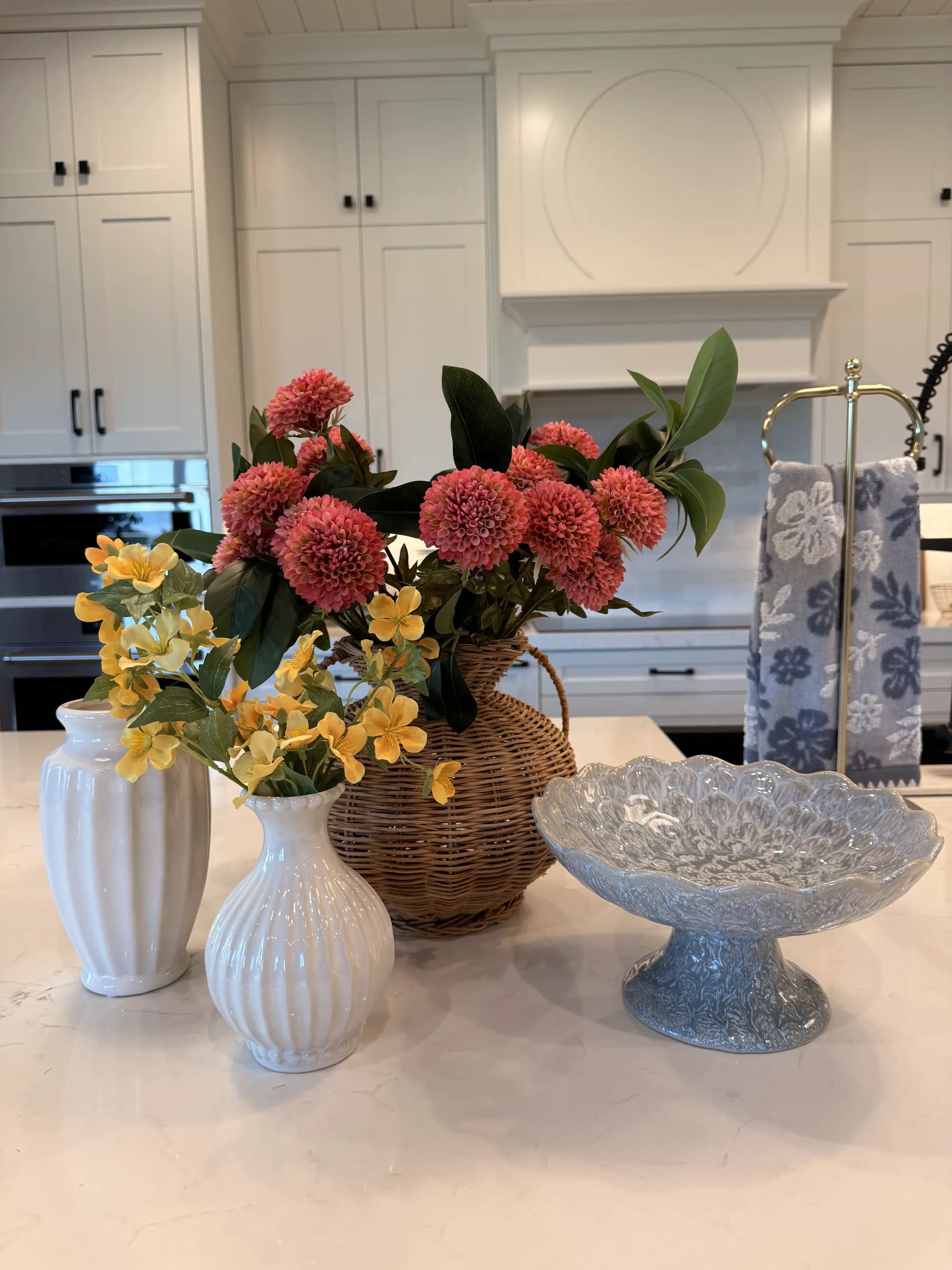 Kitchen island styled with florals and ceramics by BK Toolbox