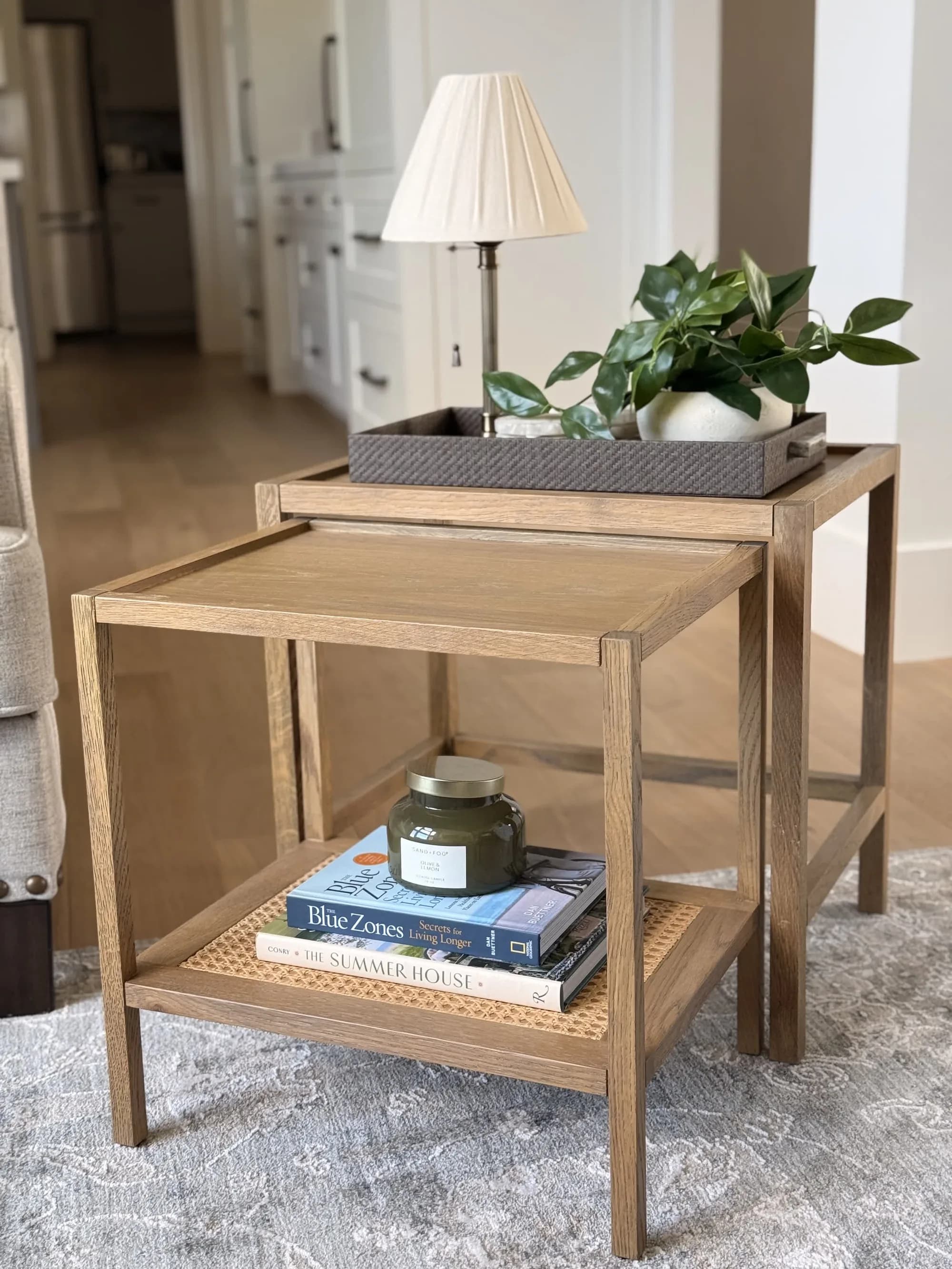 Wood nesting side tables styled with a lamp, greenery, and a tray by BK Toolbox